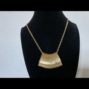 Gold tone hollow horn pendant necklace